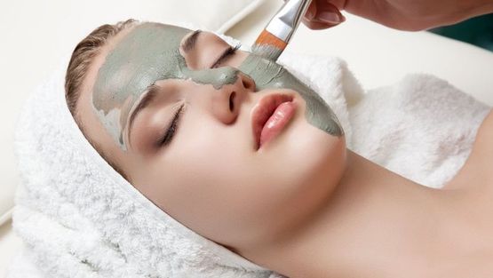 A customer receiving a facial